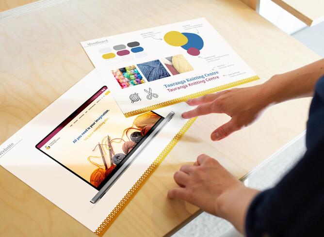 Minja with one of her website design brand guidelines printed