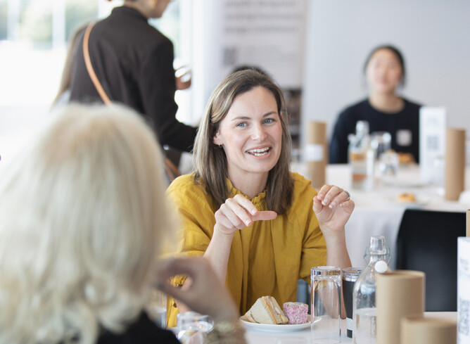 Photo showing designers talking at an event